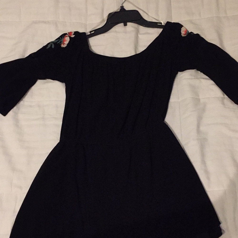 Black romper with flowers on shoulders